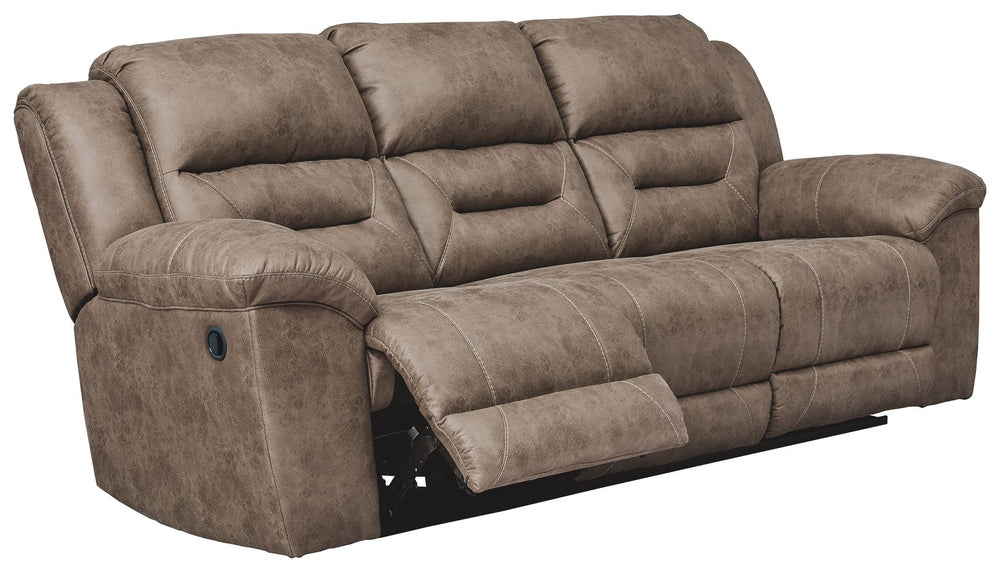 For those who love the cool look of leather but long for the warm feel of fabric, this reclining sofa delivers both with ease. Its high-performance padded faux leather is remarkably durable and easy to clean, making it just the thing for family spaces. Ch