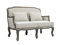 Finely crafted with superb carved details and a lovely natural finish, the Tania sofa flaunts a French cabriole silhouette that perches on graceful cabriole legs and showcases its antique-inspired profile. The nailhead trim accents give this piece a moder