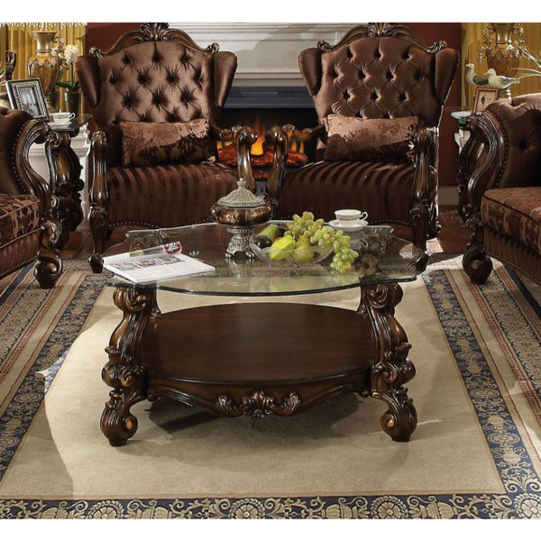 KD, Coffee Table w/Curved Glass Top â€¢ Open Compartment: Bottom Shelf â€¢ 10mm Clear Tempered Glass w/Beveled â€¢ Oversized Scrolled Legs & Shelf Apron: Poly Resin with Antique Contrast Finish<br/><br/><b>Product Features</b><ul><li>Coffee Table w/Curved