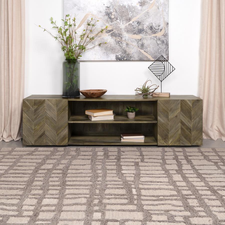 Nestle your TV atop this 70" media console, where the artistry of mango wood meets modern functionality. The rich, textured grains of the wood are arranged in a captivating veneer parquet, creating an intricate herringbone pattern that dances across the t