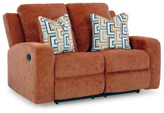 This reclining loveseat invites you to a luxuriously soft lounging experience. The chic hue fits right in with contemporary color palettes. A tufted back keeps the look right on trend. Balancing style and function, its pull tab reclining effortlessly take
