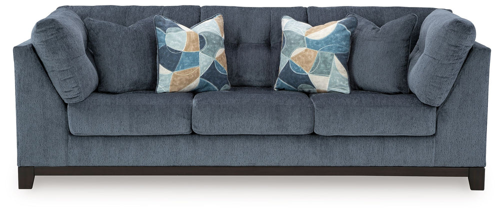 Fresh, on-trend style meets functionality in this sofa. Details like tufted cushions and a wrap-around accent base reflect your urban contemporary tastes while staying versatile as your style changes. And with its soft upholstery, your comfort is kept a p