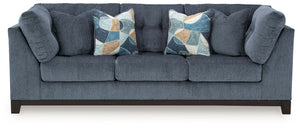 Fresh, on-trend style meets functionality in this sofa. Details like tufted cushions and a wrap-around accent base reflect your urban contemporary tastes while staying versatile as your style changes. And with its soft upholstery, your comfort is kept a p