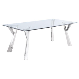 Sculptural style instantly elevates the modern glam aesthetics of a contemporary dining table. The rectangular table is topped with beautiful clear glass, complete with an elegant beveled edge for a polished look and feel in your dining room. Flared, geom