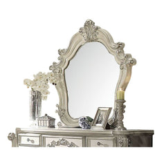 The Versailles mirror gives your bedroom all the grandeur of royal style. Presented in a stately bone white finish this mirror has a substantial silhouette and is adorned with such old-world details, carved medallions, and shaped moldings. This mirror is 