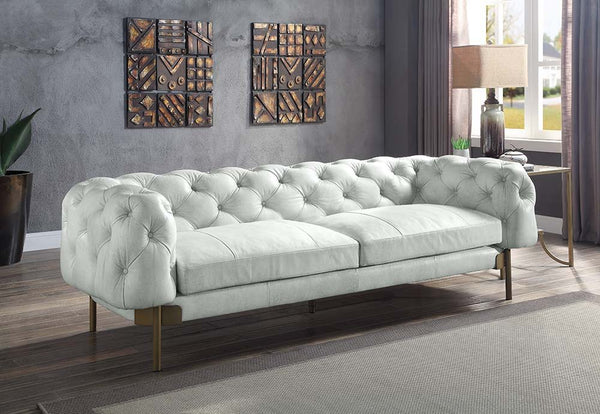This Ragle chesterfield sofa brings both modern and impressive style to your living space with luxurious Vintage White top grain leather upholstery. Diamond-tufted backrest to smooth and extremely comfortable high-density full foam cushions for a seating 