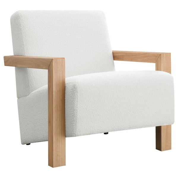 Exposed wood armrests add a sense of precision and structure to a modern accent armchair. It-'s a fresh, refined look with a neutral palette and minimalist allure. A slightly reclined seat and back create an inviting silhouette for the chair, which blends