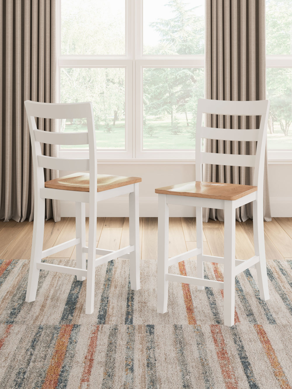Complement your homeâ€™s simply relaxed sensibility with this counter height bar stool. A crisp white hue offers a chic contrast to the natural wood tone, for a neutral look that vibes with a variety of aesthetics. Its hard, contoured seat design prioriti
