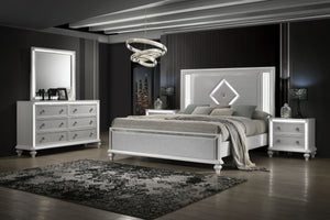 Introducing the Stardust Piece Bedroom Suite, including a Bed, Dresser, Mirror and 2 Nightstands in a glossy white finish. Crafted with durability and style in mind, each piece is meticulously constructed from manufactured wood with an eco-friendly decora