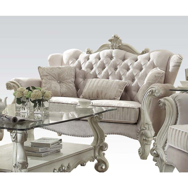 The Versailles collection with bone white finish will create you an elegant, warm and traditional taste in your living room. The sofa set reflects highly decorative base with scrolled feet, and the upholstered seats with the deep button tufted and Nailhea