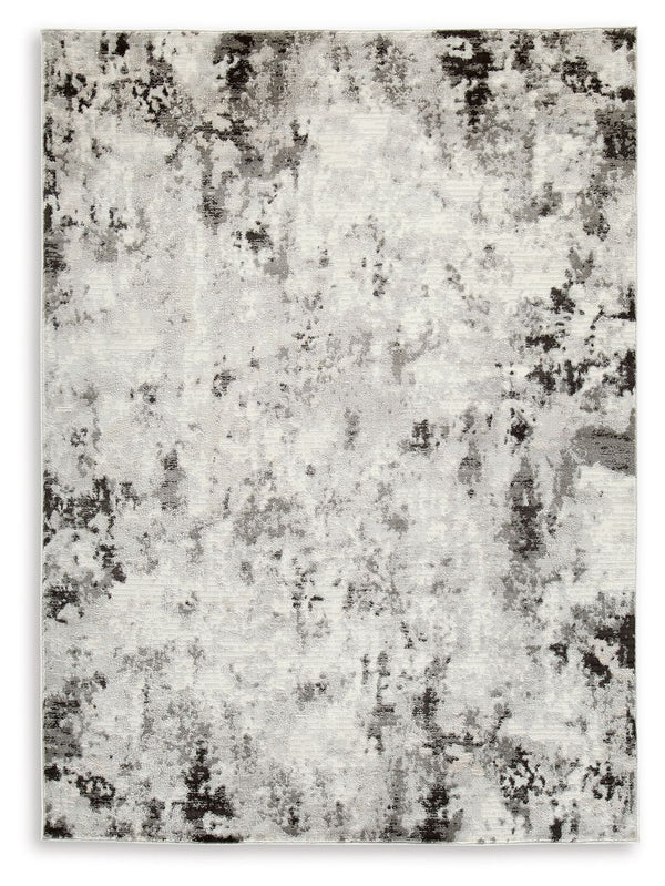 Upgrade your space with unapologetic glamour. This area rug serves as a simplistic yet compelling representation of modern decor. Its abstract design, subtle hues, refined machine woven construction and soft durable yarns provide long-lasting beauty and c