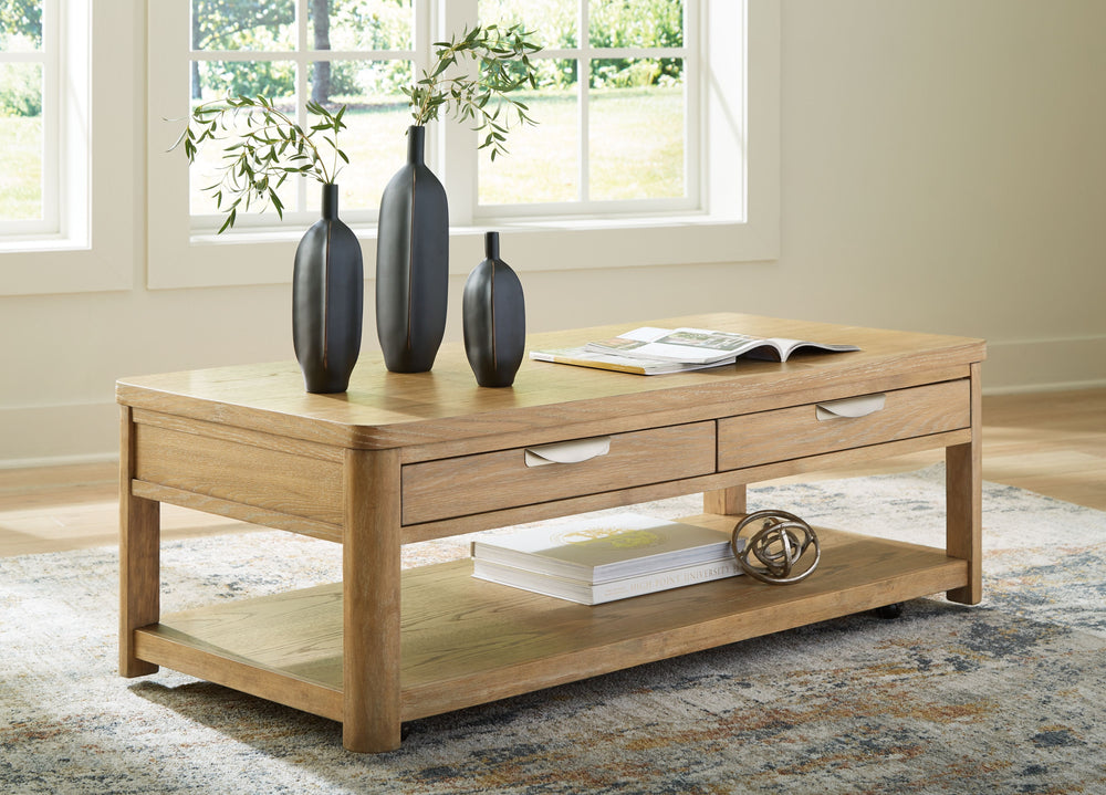 This coffee table-'s classic yet contemporary good looks are hard to deny. Softly shaped posts with a light oak finish and wire-brushed wood grain texture lend an organic appeal to your soothing space. Roomy drawers cater to additional storage needs while