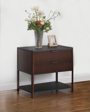 which can also serve as a stylish bedside table. Its two spacious drawers feature elegant fluted detailing