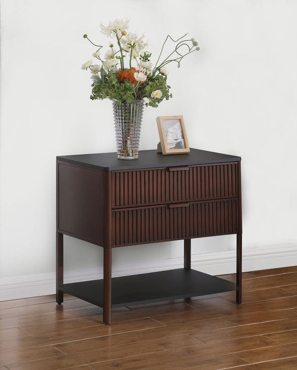  which can also serve as a stylish bedside table. Its two spacious drawers feature elegant fluted detailing