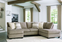 Easy on the eyes, this double chaise sectional expands your seating options with ease. Its generous scale cradles you in comfort, while luxurious upholstery pampers you from head to toe. A collection of coordinating accent pillows adds to the indulgence. 