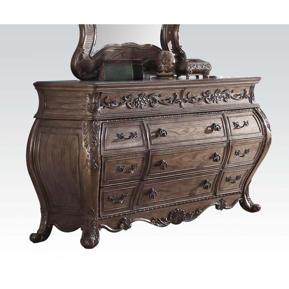 The Ragenardus dresser is an impeccable example of truly memorable luxurious traditional design. This eleven-drawer vintage oak dresser features a detailed French style front and English back in a stunning Bombay shape case, Felt-Lined top drawer, side me