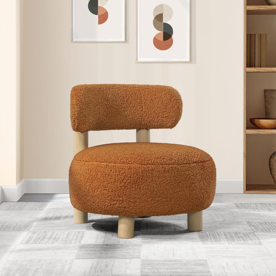 Play with proportionality with the intriguing silhouette of this modern accent armchair. Designed to make a statement in your living area, it boasts thick, plush boucle upholster that sets a trendy ambiance. The chair shows off a low profile, complete wit