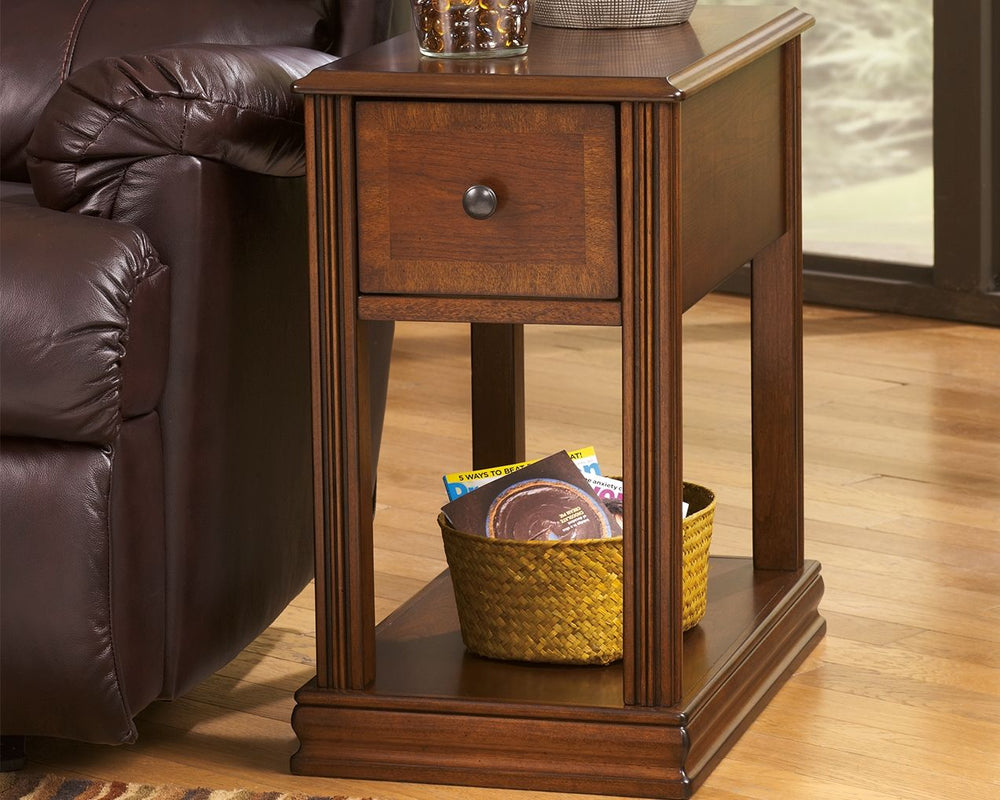 Inlay accents, fluted details and an oil-rubbed effect on the rich finish give this chairside end table such great character. The base shelf is just the place for a storage basket, decorative vase or other accent piece. Youâ€™ll love the deep drawer with 