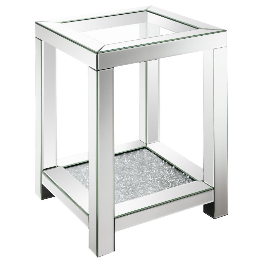 Add Hollywood Regency vibes to your decor with this glam mirrored end table. Featuring a tempered clear glass top and beveled mirror trim, it exudes modern flair and timeless elegance. The sparkling acrylic jewel-encrusted bottom shelf enhances its chic, 