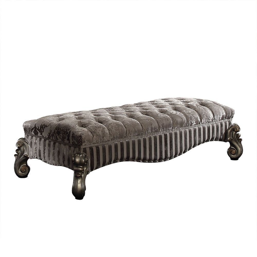 Assembled, Armless Bench (Backless/No Storage) Tight Seat Cushion w/Welted Trim Padded Seat: Button Tufted, Seat: Floral Pattern Fabric, Contrast Base: Stripped Pattern Fabric Scrolled Apron w/Nailhead Trim Scrolled Legs: Poly Resin with Antique Contrast 