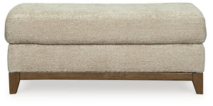  showcasing soft upholstery accented with a transitional wood trim. As refined as it i