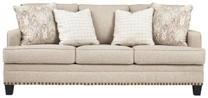 A case of contemporary and classic style influences coming together in a beautiful way, this sofa in beige brings a fresh perspective to modern farmhouse living. Distinctive elements include t-cushions that wrap around setback track arms, nailhead trim an