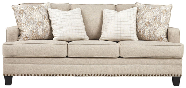 A case of contemporary and classic style influences coming together in a beautiful way, this sofa in beige brings a fresh perspective to modern farmhouse living. Distinctive elements include t-cushions that wrap around setback track arms, nailhead trim an