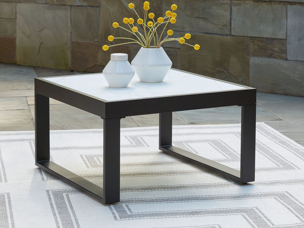 Sleek, contemporary style meets outdoor living in this coffee table. Its clean-lined black aluminum frame expertly balances good looks and longevity. A stunning top provides the natural stone look you love, while its glass construction weathers the season