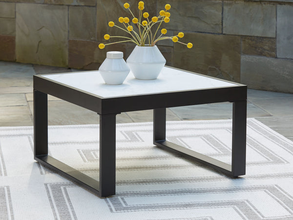  contemporary style meets outdoor living in this coffee table. Its clean-lined black aluminum frame expertly balances good looks and longevity. A stunning top provides the natural stone look you love