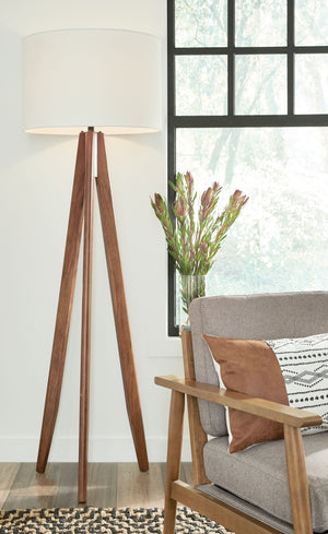  contemporary style to any room in your home with this floor lamp. Its eye-catching tripod design includes a coordinating fabric drum shade for a complete look. Ideal for a reading space or transitional office space