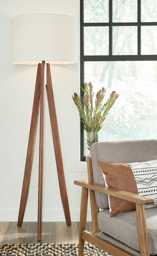  contemporary style to any room in your home with this floor lamp. Its eye-catching tripod design includes a coordinating fabric drum shade for a complete look. Ideal for a reading space or transitional office space