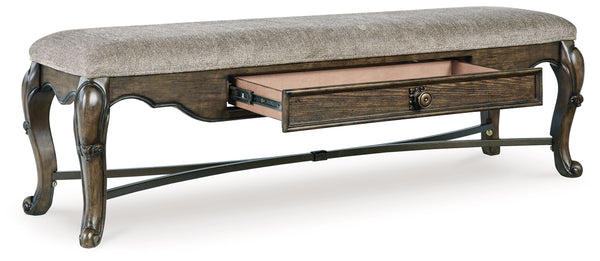  a plush cushioned seat and a storage drawer