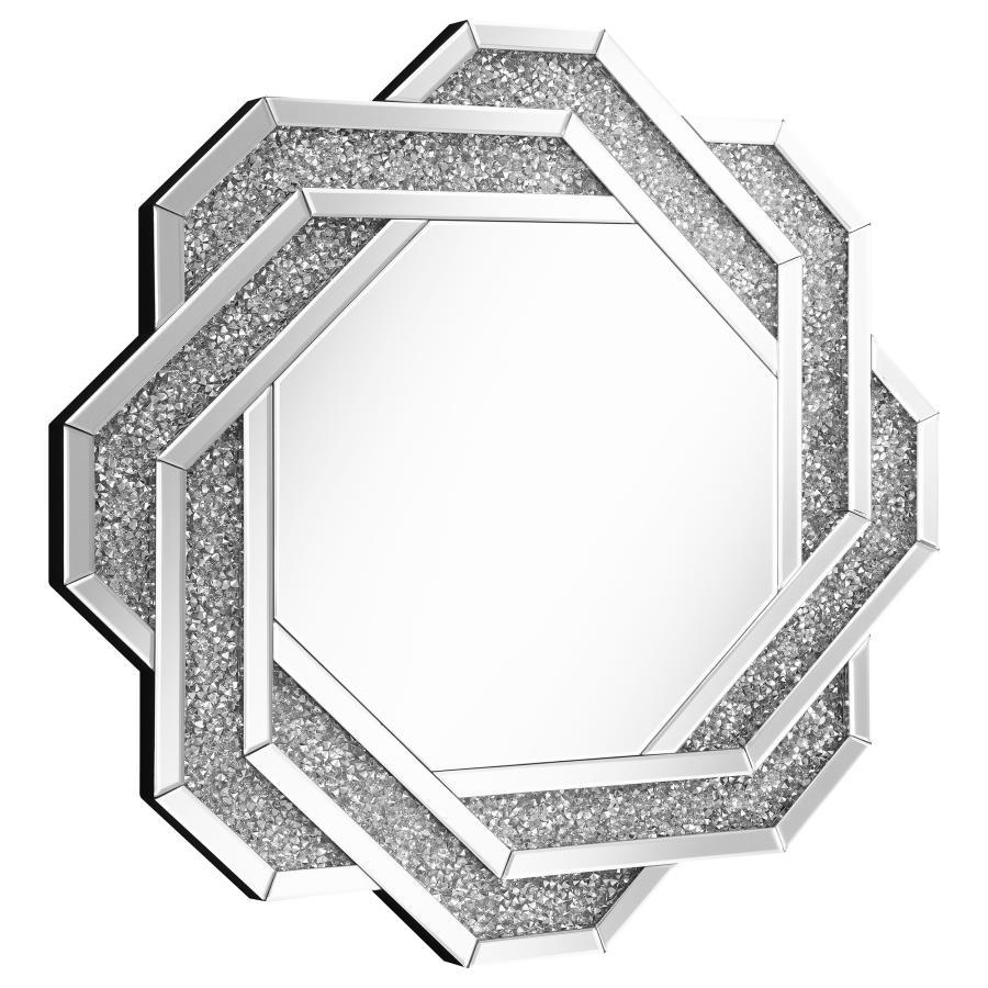 This decorative wall mirror features a striking octagonal silhouette with a mirrored frame inset with faceted acrylic crystal inlay. Designed to make a statement, the overlapping geometric pattern brings dimension and a touch of glam to any room. Without 