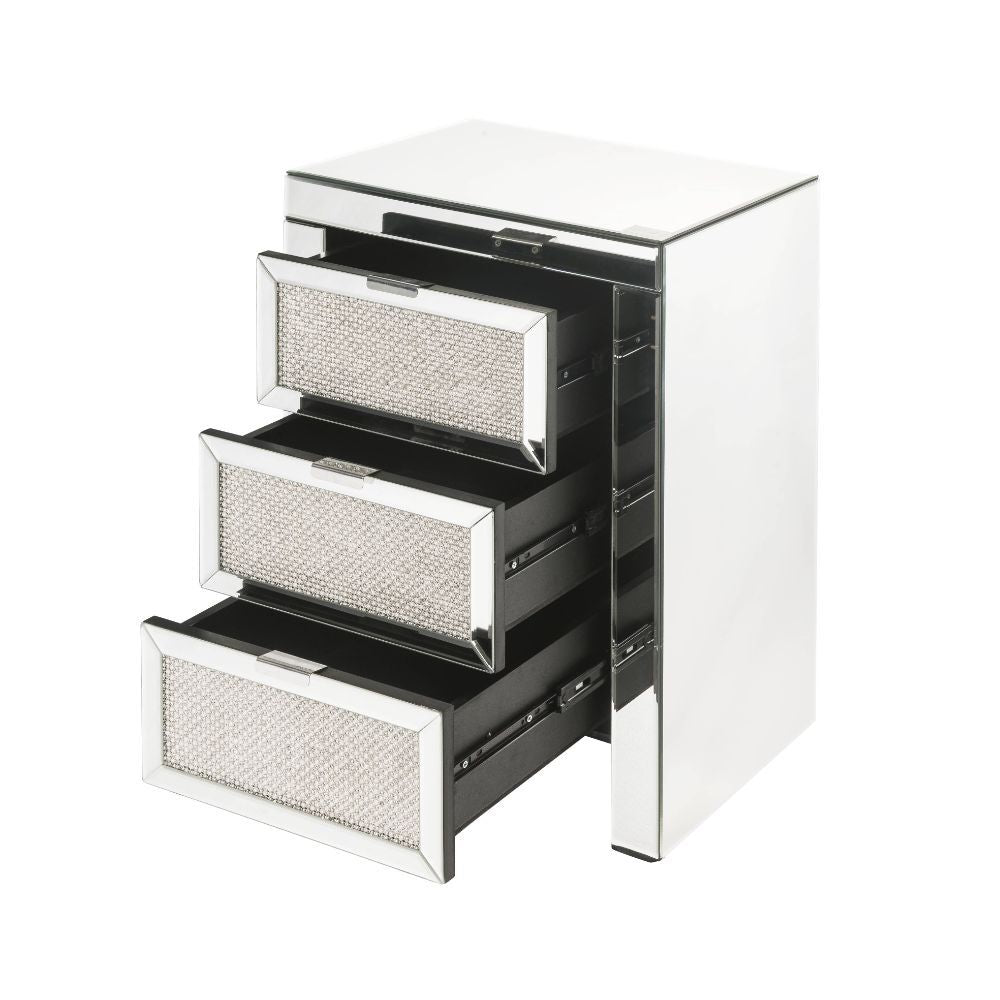 The Lavina occasional table brings glam styling to your home. The quality construction of this table features a combination of mirrored glass and composite wood, ensuring a design that endures. Three drawers with faux diamonds Inlay drawer fronts, It-'s j