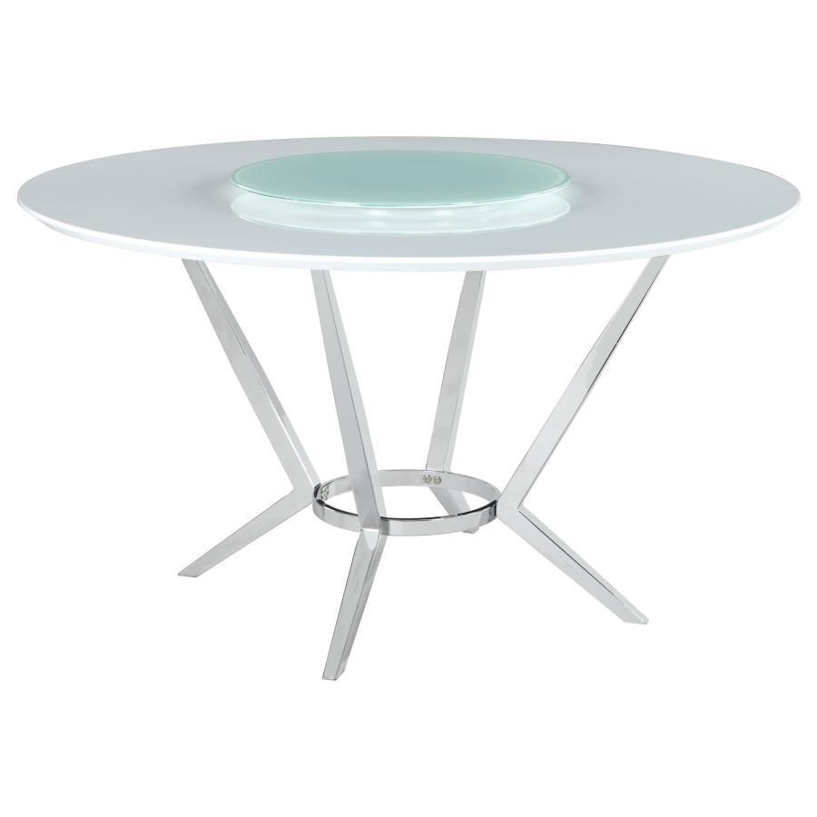 Elegant and ultra-modern, this round dining table pairs a high gloss white top with a tempered glass lazy Susan for added function. Its metal base features boomerang-style legs finished in electroplated chrome, delivering sculptural appeal and stability. 