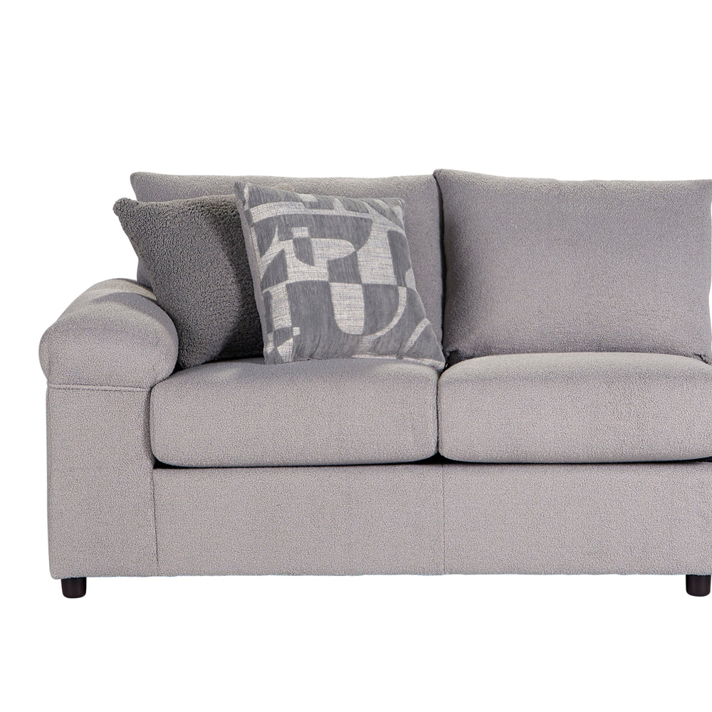 Introducing the Remi 2 Pc. Chaise Section in Light Gray, a sophisticated addition to your living space. This sectional includes a roomy Chaise Lounge and a Loveseat that seats three, accompanied by four coordinating accent pillows for added flair. Made in