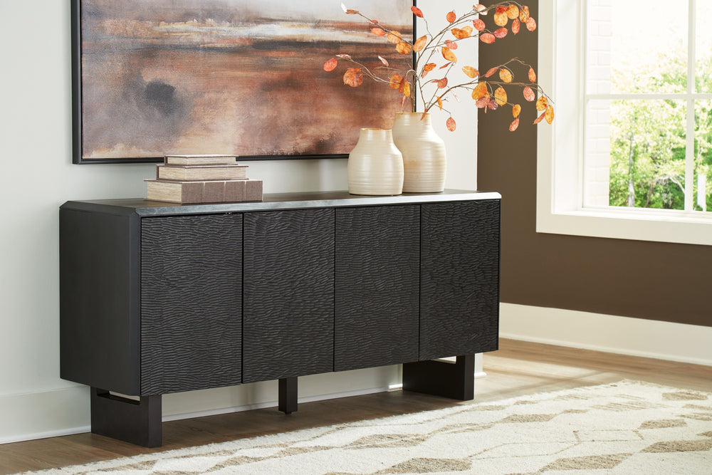 Function and style merge perfectly with this accent cabinet. Crafted of solid wood in a black finish, this piece makes a great case for fresh contemporary design. Doors with a carved pattern open to reveal shelving, while beveled edges add a distinctive t