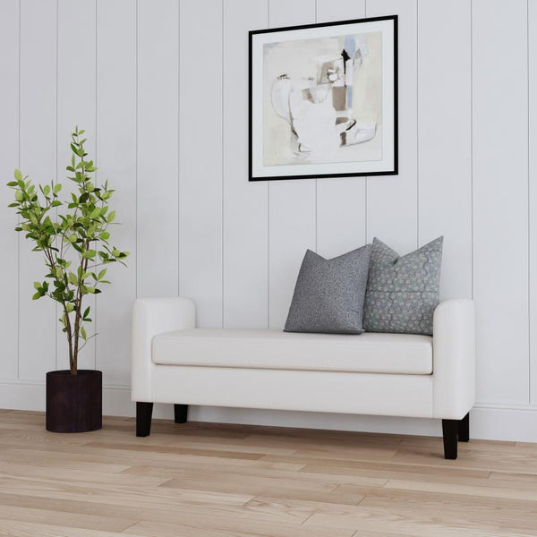  cozy silhouette. The bench seat and frame are upholstered in soft vanilla fabric