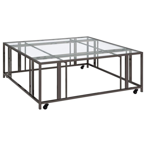This square coffee table combines functionality with modern style, featuring a tempered glass top and a sturdy geometric base made from heavy-gauge metal. The open-frame design creates a sleek, contemporary look, while smooth-rolling casters add mobility 