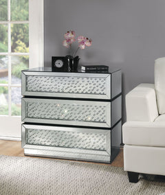 The Nysa mirrored console table demonstrates sophisticated, graceful and elegant, style with unique design. This console table features three oversized drawers decorated with glass crystals. While elegantly reflecting its surroundings, combines glamour wi