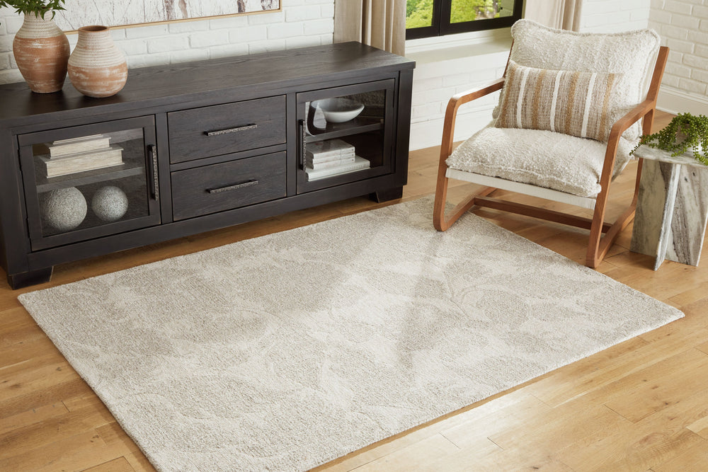 Looking to soften your hardwood or tile floors? This area rug, crafted with an elegant floral pattern and neutral hue, produces just the right look. Hand-tufted with wool, it adds a little extra cushioning under your feet.<br/><br/><b>Product Features</b>
