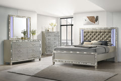 Discover the Radiance Queen 4 Piece Bedroom Set in Platinum Silver, meticulously crafted to offer unparalleled stability and durability from a combination of Solid Rubberwood and manufactured woods. Its semi-gloss lacquer Platinum Silver finish lends a si