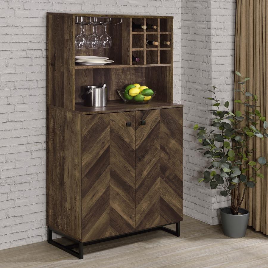 This rustic bar cabinet features a striking herringbone pattern and a warm oak finish, perfect for enhancing any living or dining space. With ample bottle and stemware storage, it offers function and flair in equal measure. The mixed material construction