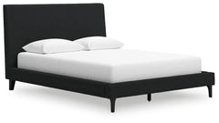 This queen upholstered bed reflects your sophisticated approach to boho style. Crafted with both form and function in mind, its black boucle fabric brings trend-right beauty to bedtime. The versatile design suits all-neutral spaces or blends with your fav