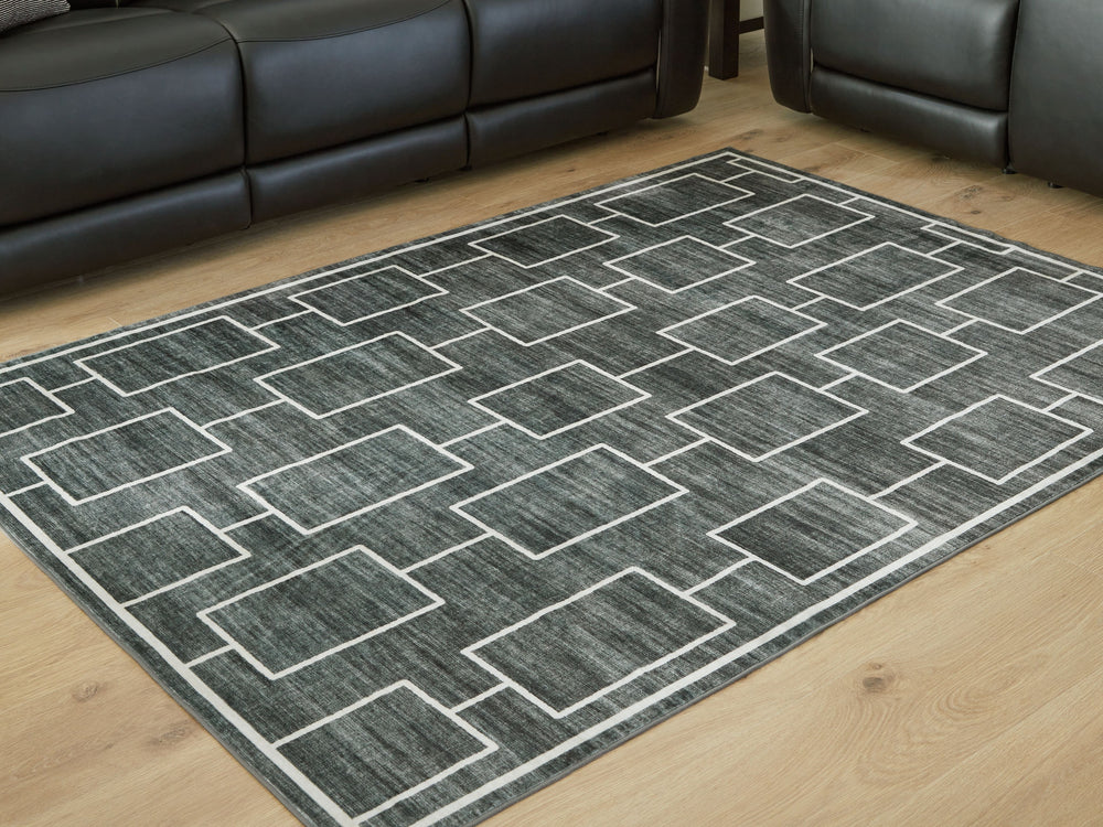 The soft, welcoming faux fur construction of this rug is complemented by a clean-lined geometric design. Its neutral black and gray tones give you the must-have versatility to pair it with existing contemporary decor. Plus it-'s machine washable for added