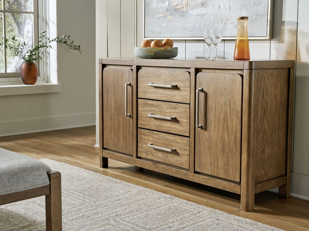 Define your dining room with reliable function and style. This dining server sits comfortably at the intersection of modern lodge and farmhouse aesthetics. Charming architectural elements and a light brown glazed finish reflect your warm and welcoming dis