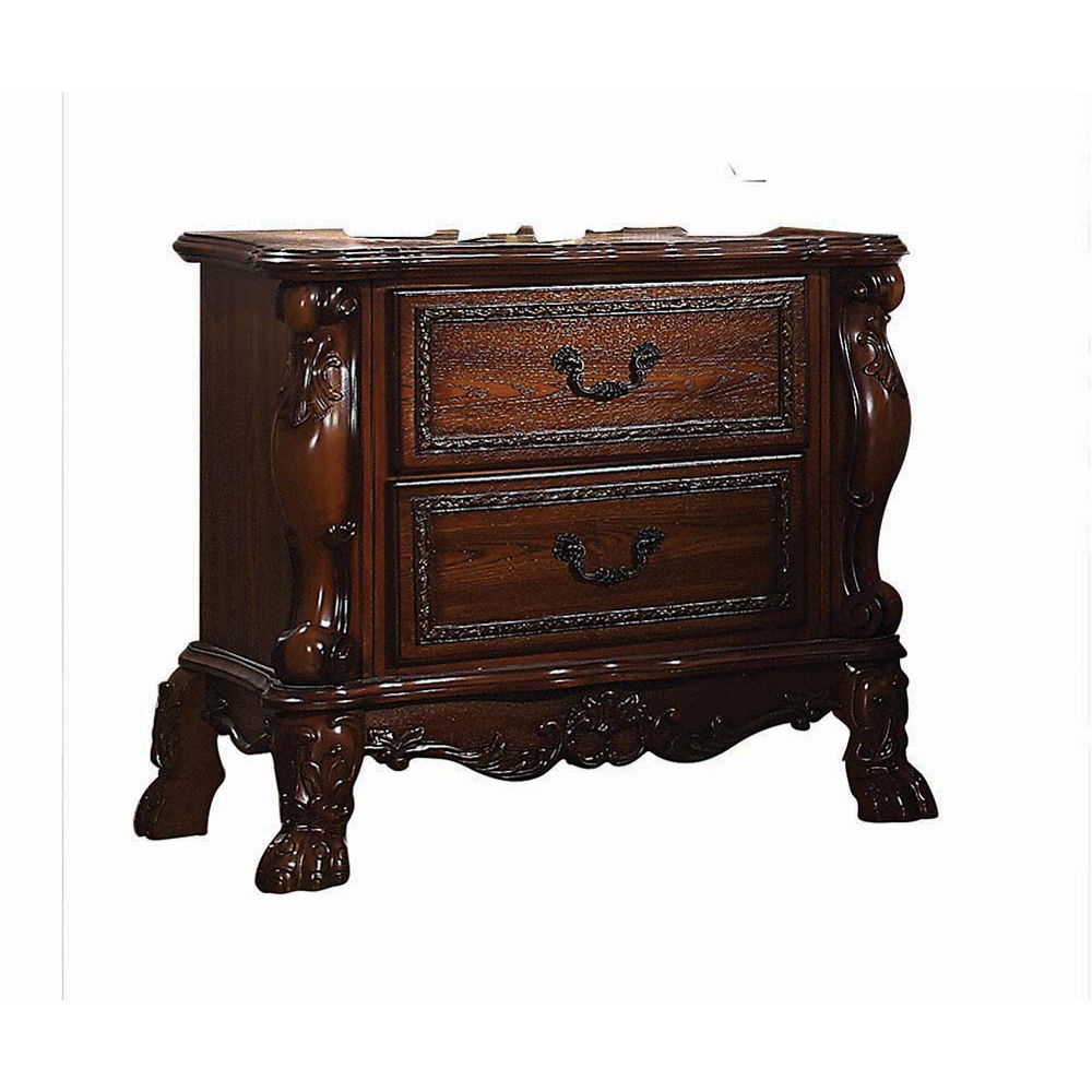 The Dresden Nightstand in Cherry Oak offers beautiful craftsmanship and artistic carvings. It features solid hardwood with two drawers for storage with coordinating carvings. The drawers feature dove tail construction and are decorated with antique brass 