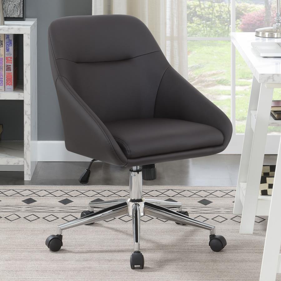 Wrapped in soft and smooth leatherette, this modern office chair features contoured edges for an elegant, contemporary silhouette. Lean against the supportive, comfortable backrest as you focus on work and other tasks. The seating also features a pintuck 