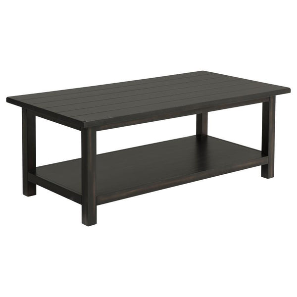 Bring timeless appeal and ample surface space to your living area with this rectangular coffee table. A pine wood and engineered wood construction, enhanced by pine veneer, ensures durability while exuding a warm rustic charm. Its open lower shelf keeps d