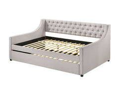 The fully upholstered daybed embodies a classic aesthetic infused with rich textures. Wooden frame is graced with gentle curves and elegant details while button-tufted fog fabric upholstery makes you indulge in a luxurious comfort. An additional trundle u